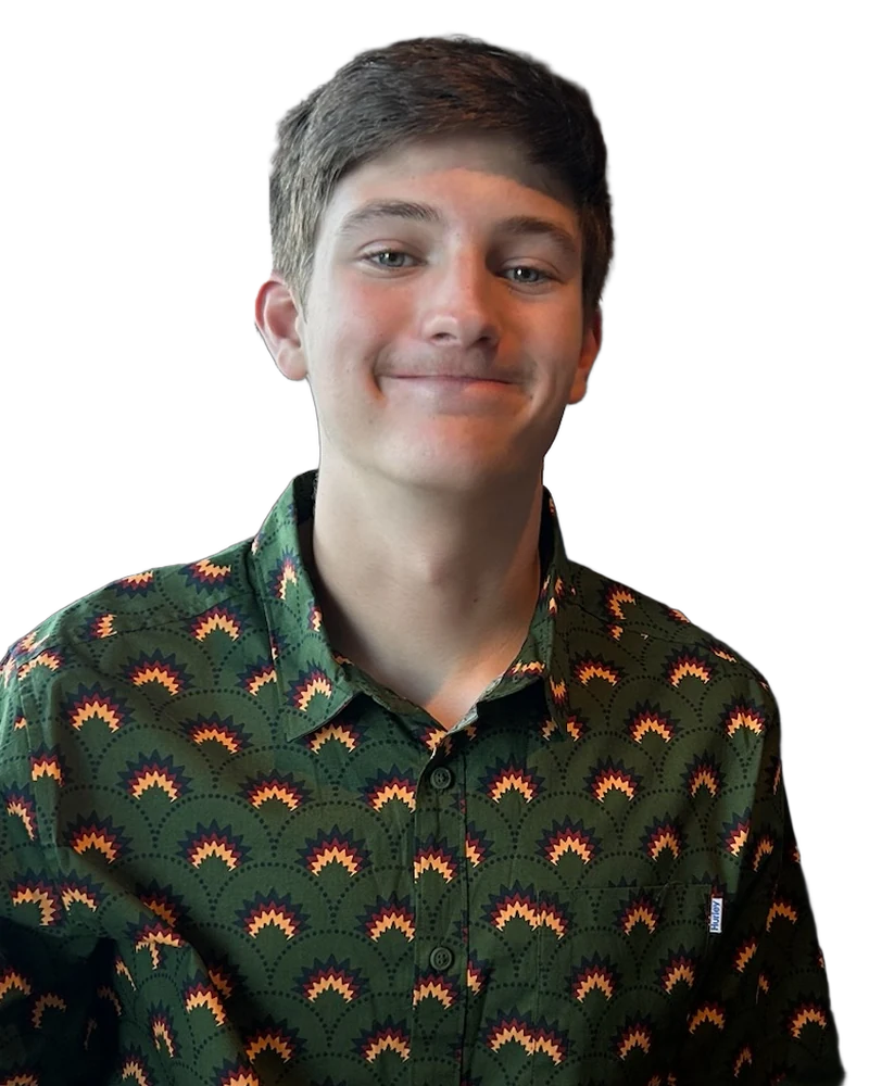 Nate Greene smiling, in a green patterned button-up shirt