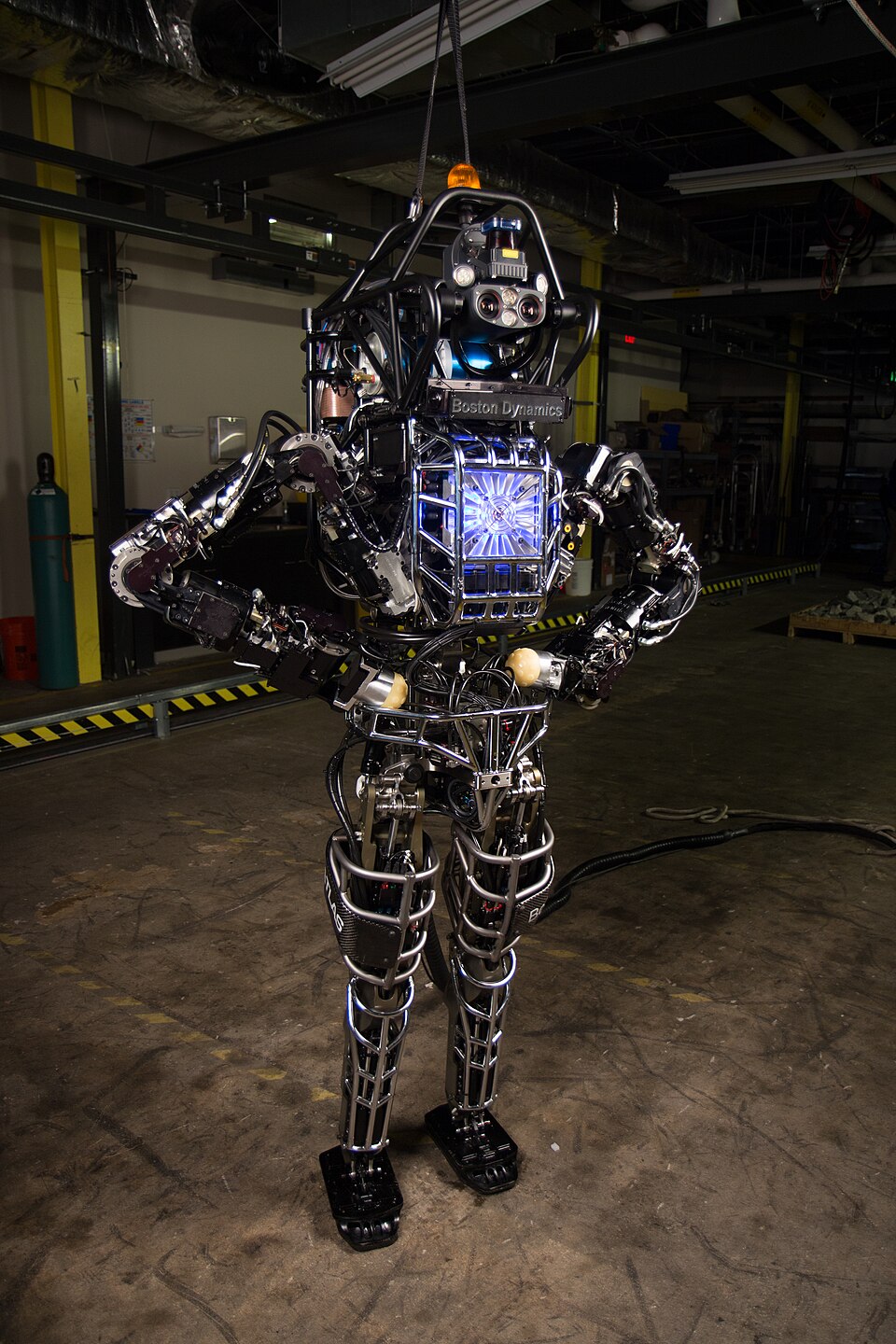 Boston Dynamics' Atlas robot standing in a lab